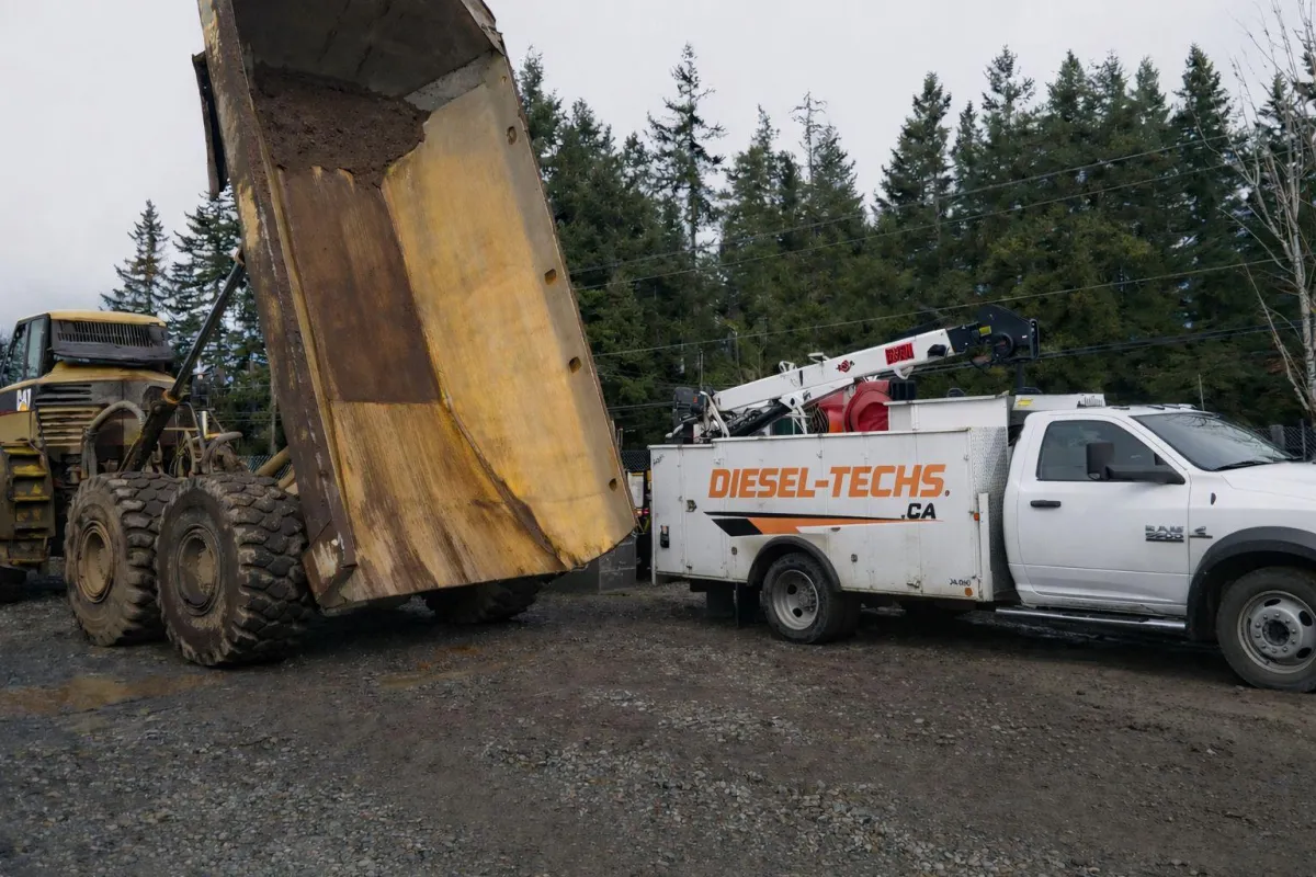 mobile diesel mechanic in Northern Aberta working on forest truck
