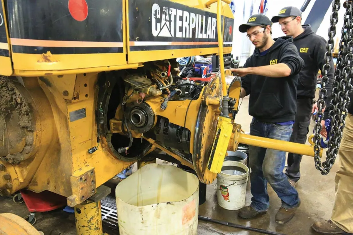 Construction diesel equipment on job site with mobile diesel mechanic, mobile diesel mechanic in Northern Aberta working on highway truck