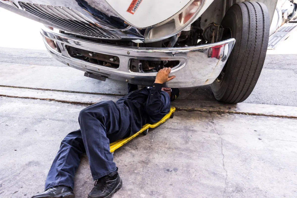 mobile diesel mechanic in Northern Aberta working on highway truck