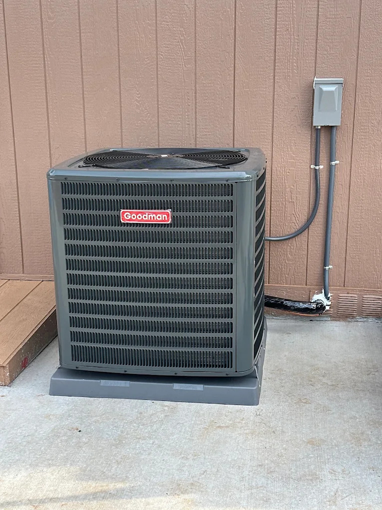 a wall mounted air conditioner mounted on the side of a building