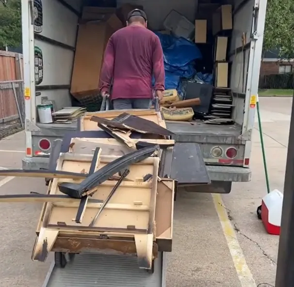 person holding a black and white bottle