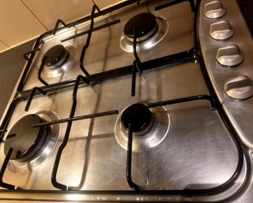 Gas cooktop degreased during an end of lease clean in Adelaide