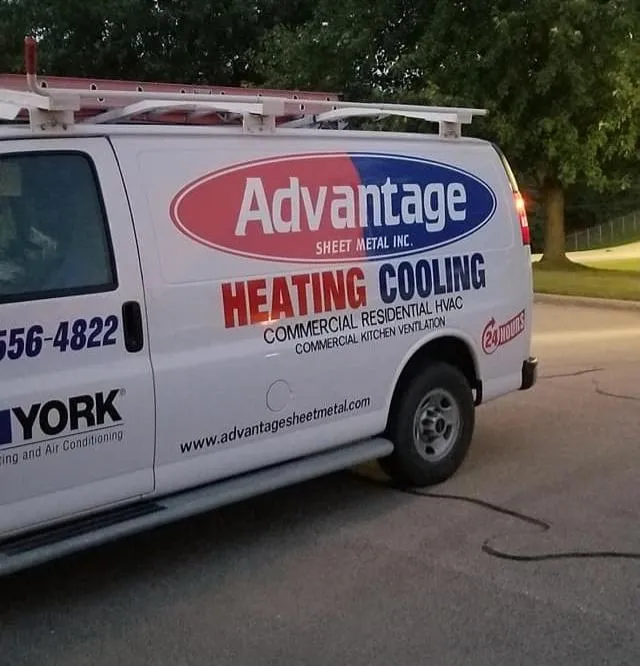 Technician working on rooftop HVAC unit.