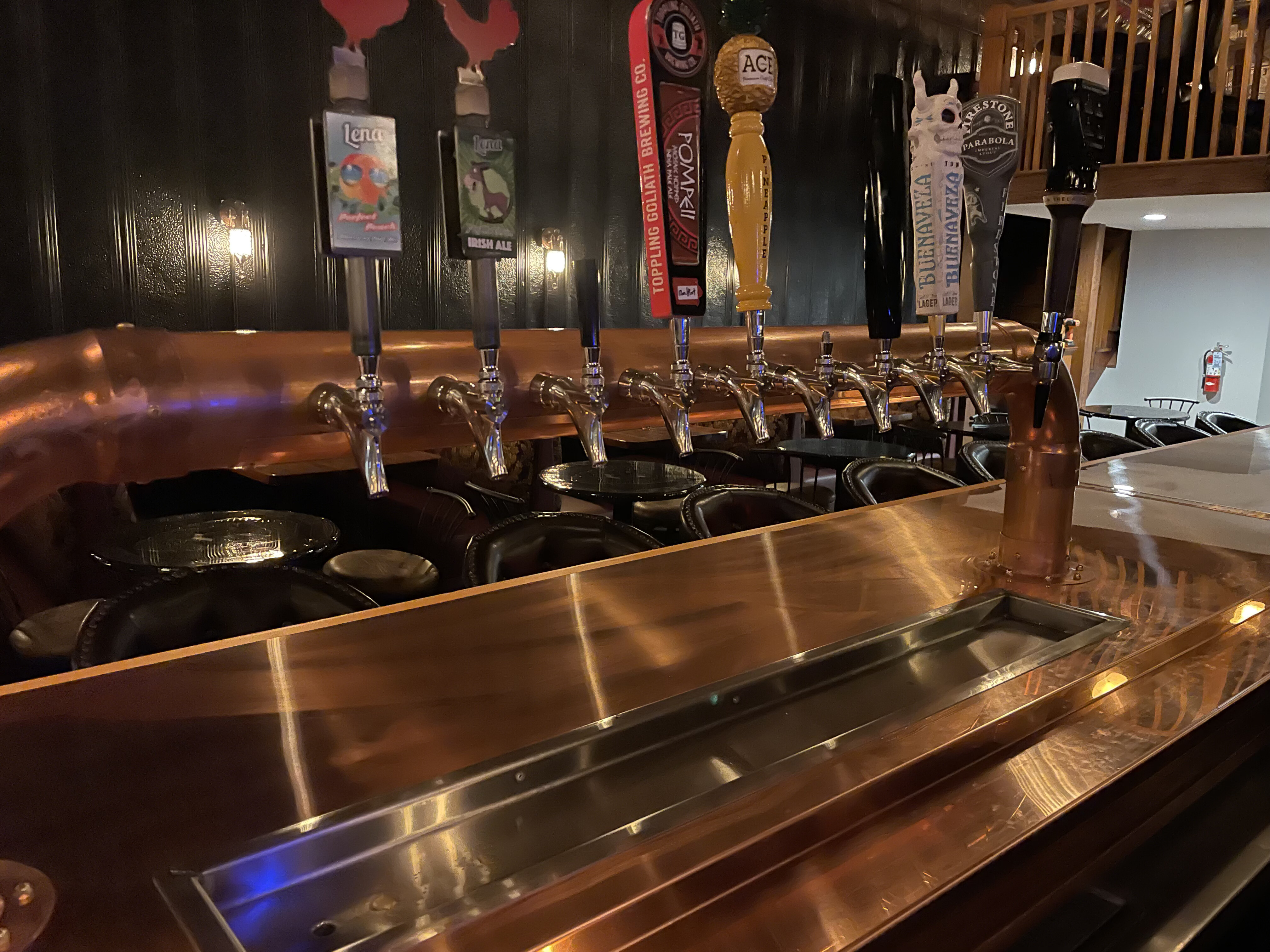 Sheet metal fabrication shop with formed and welded metal components being assembled for commercial use.