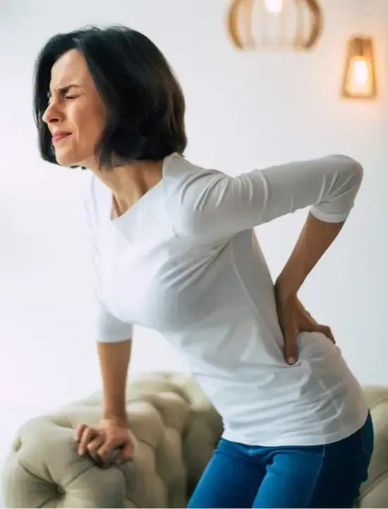 Lady bent over with back pain