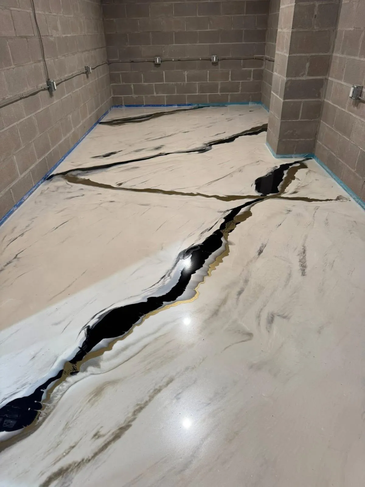 metallic epoxy using white, black, and gold colours