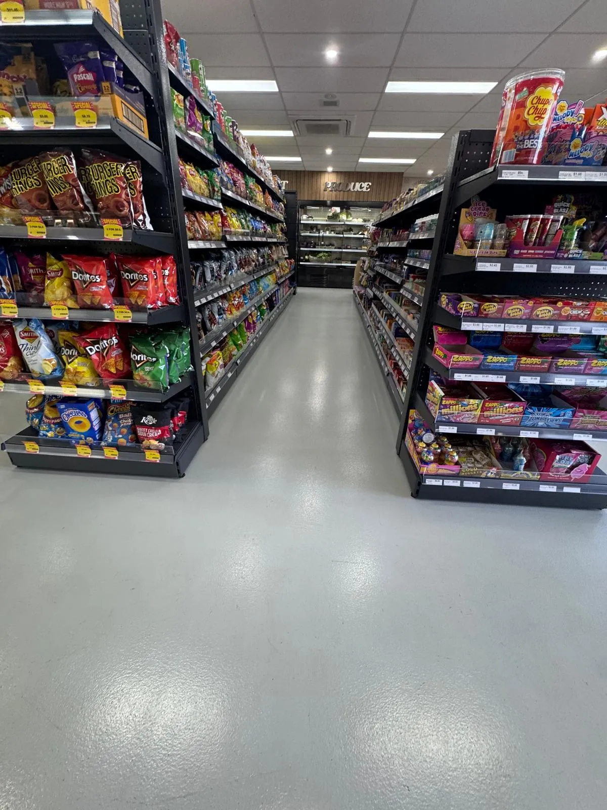 plain epoxy grey floor applied to petrol station shop aisles