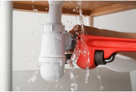 Plumber updating residential plumbing systems for improved efficiency.