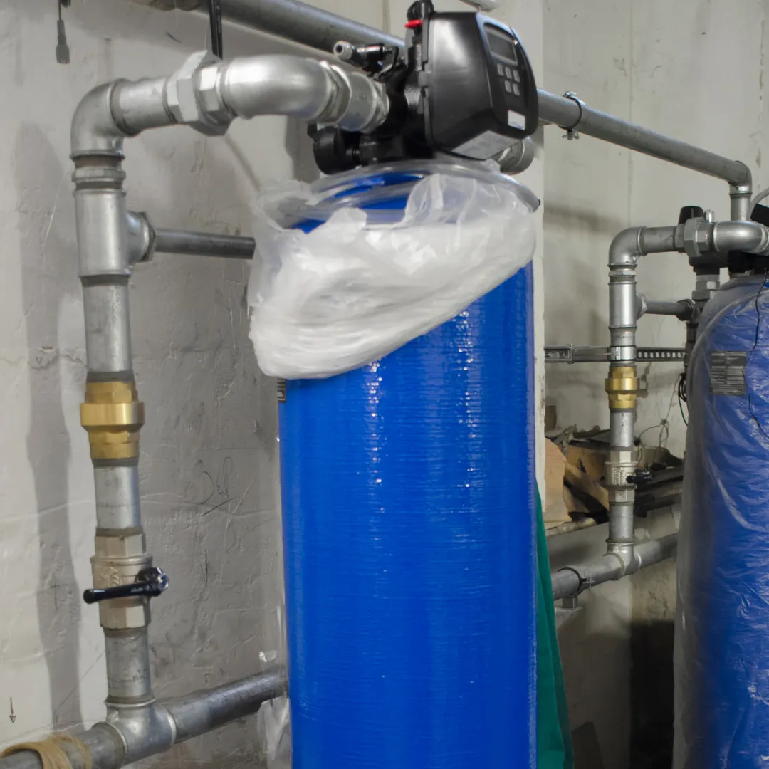 A water softener system being installed to reduce water hardness and prevent scale buildup in plumbing and appliances.