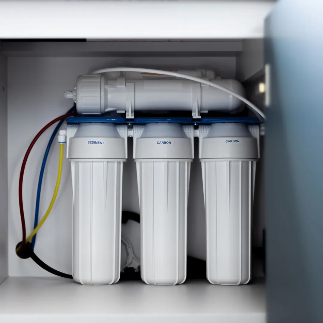 A house water filtration system being installed to provide clean, filtered water throughout the home, improving taste and quality.