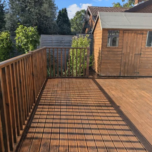 Wooden deck installation beside shed in Bournemouth Dorset