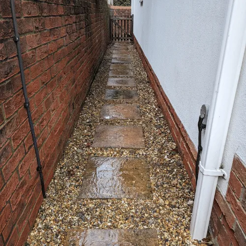 Stone slab and gravel pathway installation in Dorset property