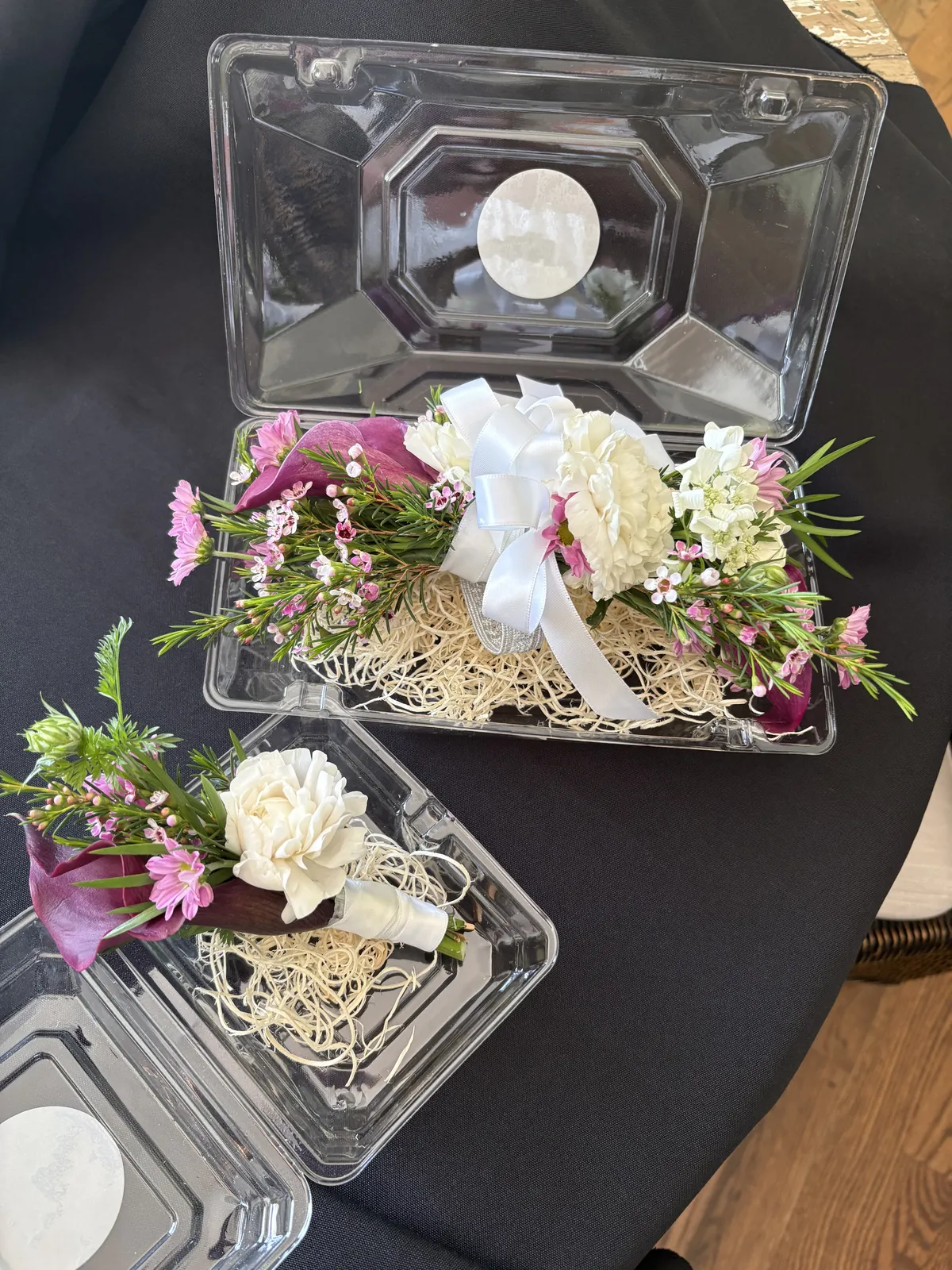Elegant wedding floral arrangement on rustic wood
