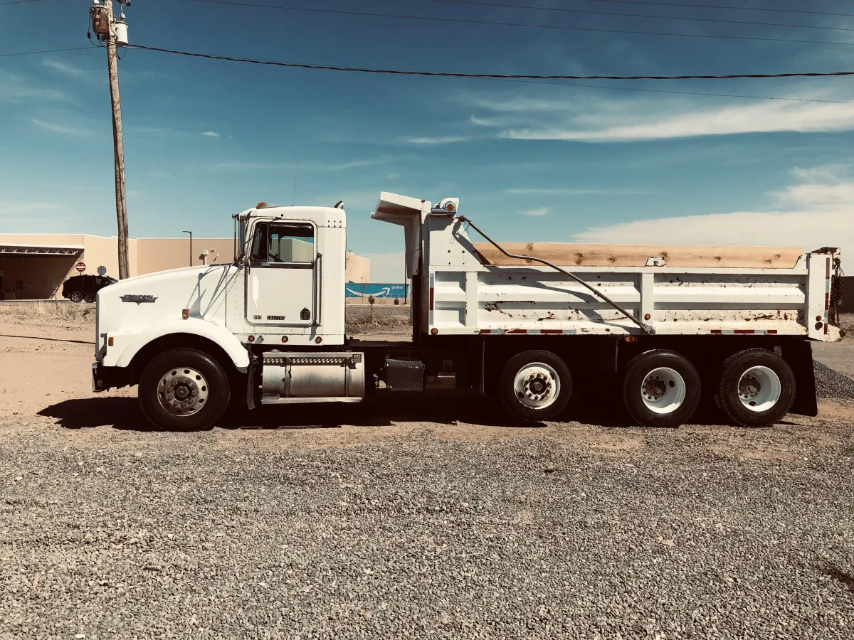 Dump truck hauling dirt and gravel