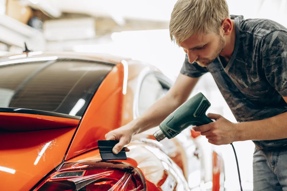Technician working on car body repair