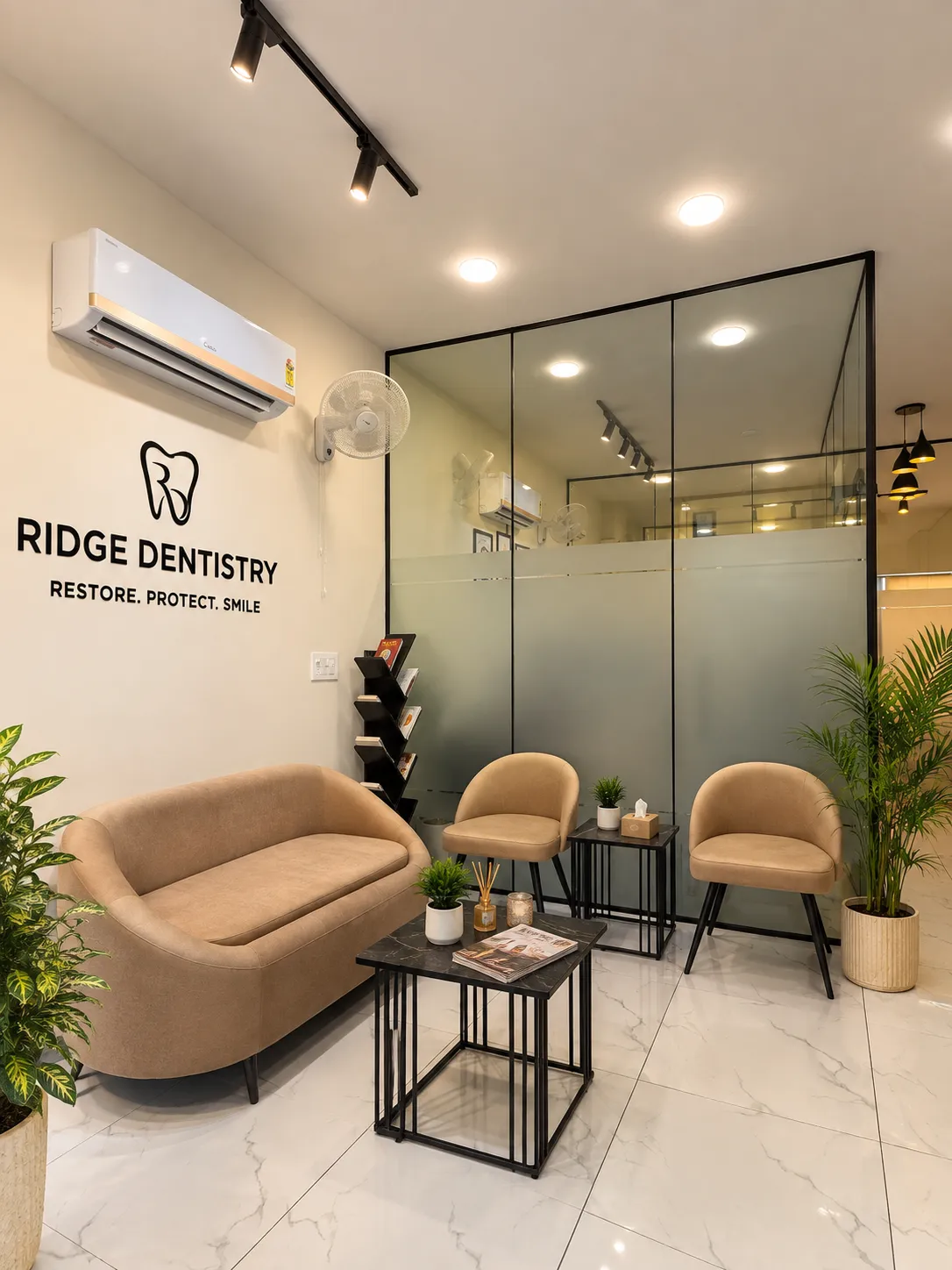 Bright, modern dental clinic reception area with marble desk, beige sofa, warm lighting, and plant