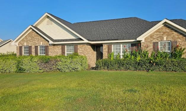 Front yard in Augusta GA with fresh mowing and well-maintained hedges and plants