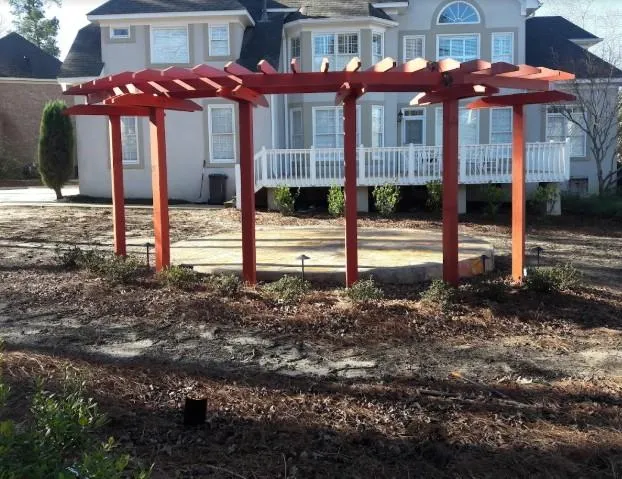 Backyard pergola over a cozy seating area offering shade and outdoor style