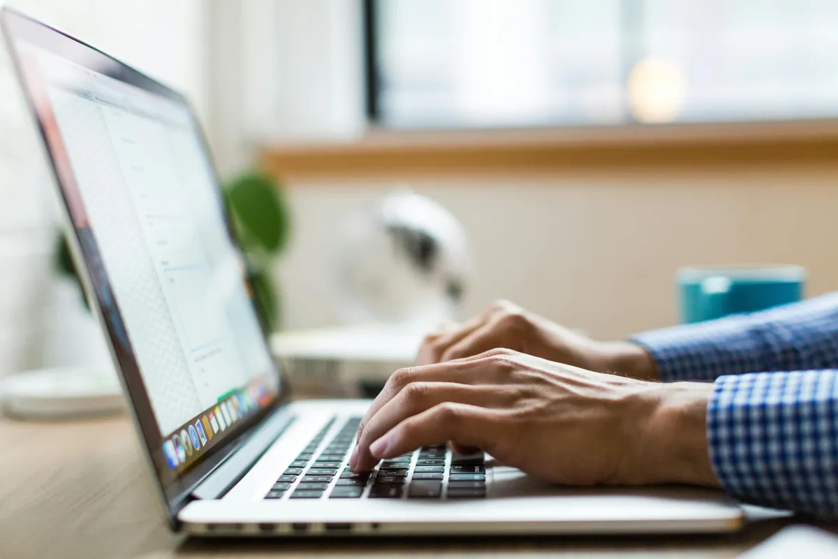 A man browsing in his laptop