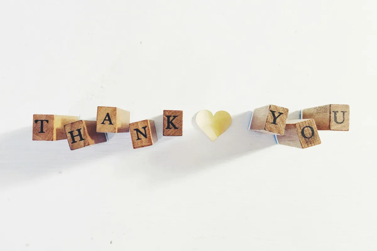 scrabble tiles spelling thank you