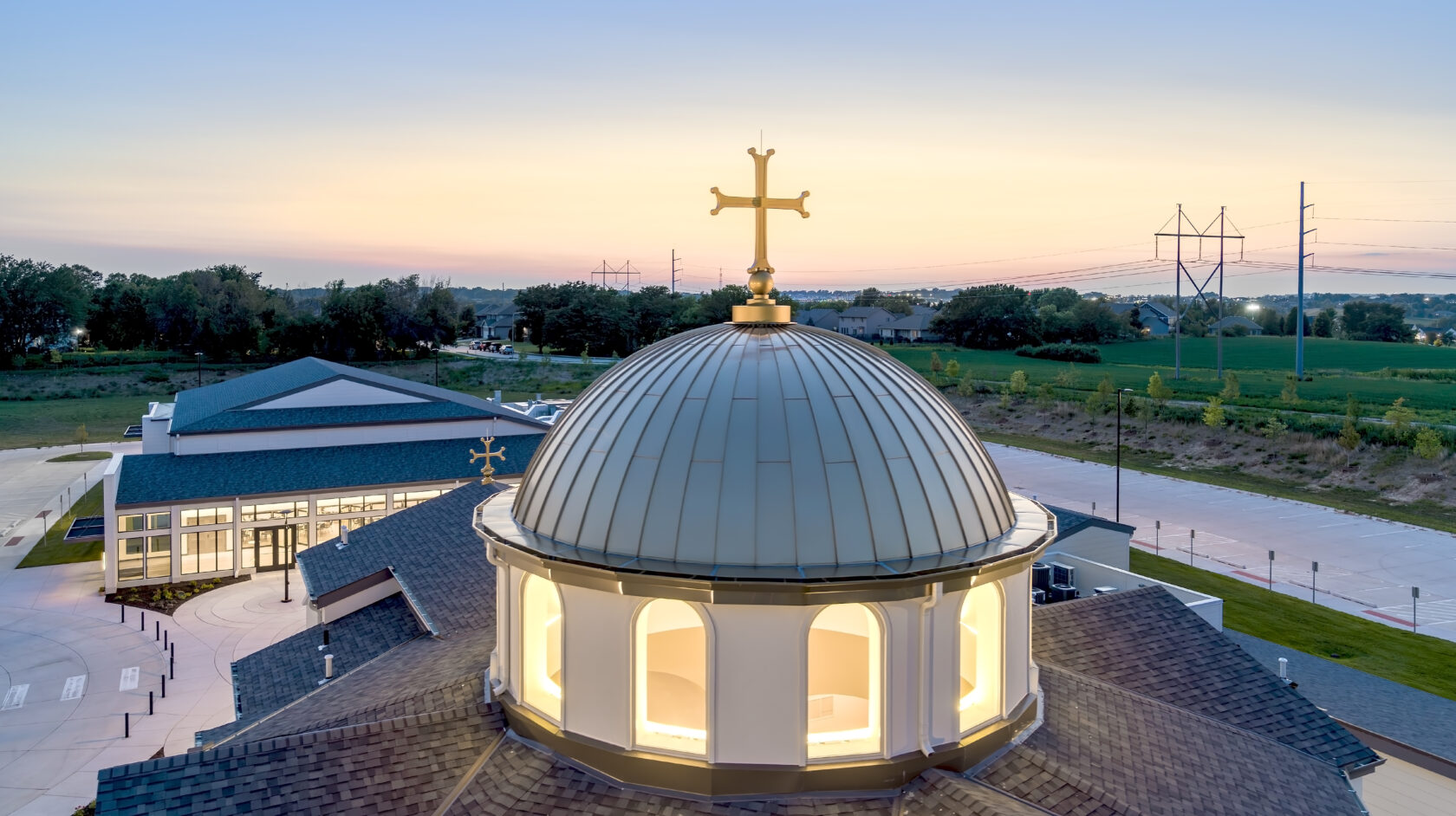 a gold statue of a child with curly hair