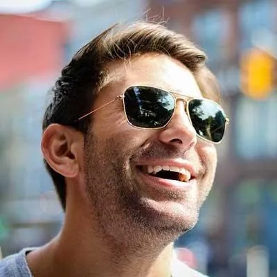 Electrician inspecting a commercial electrical panel in New Zealand