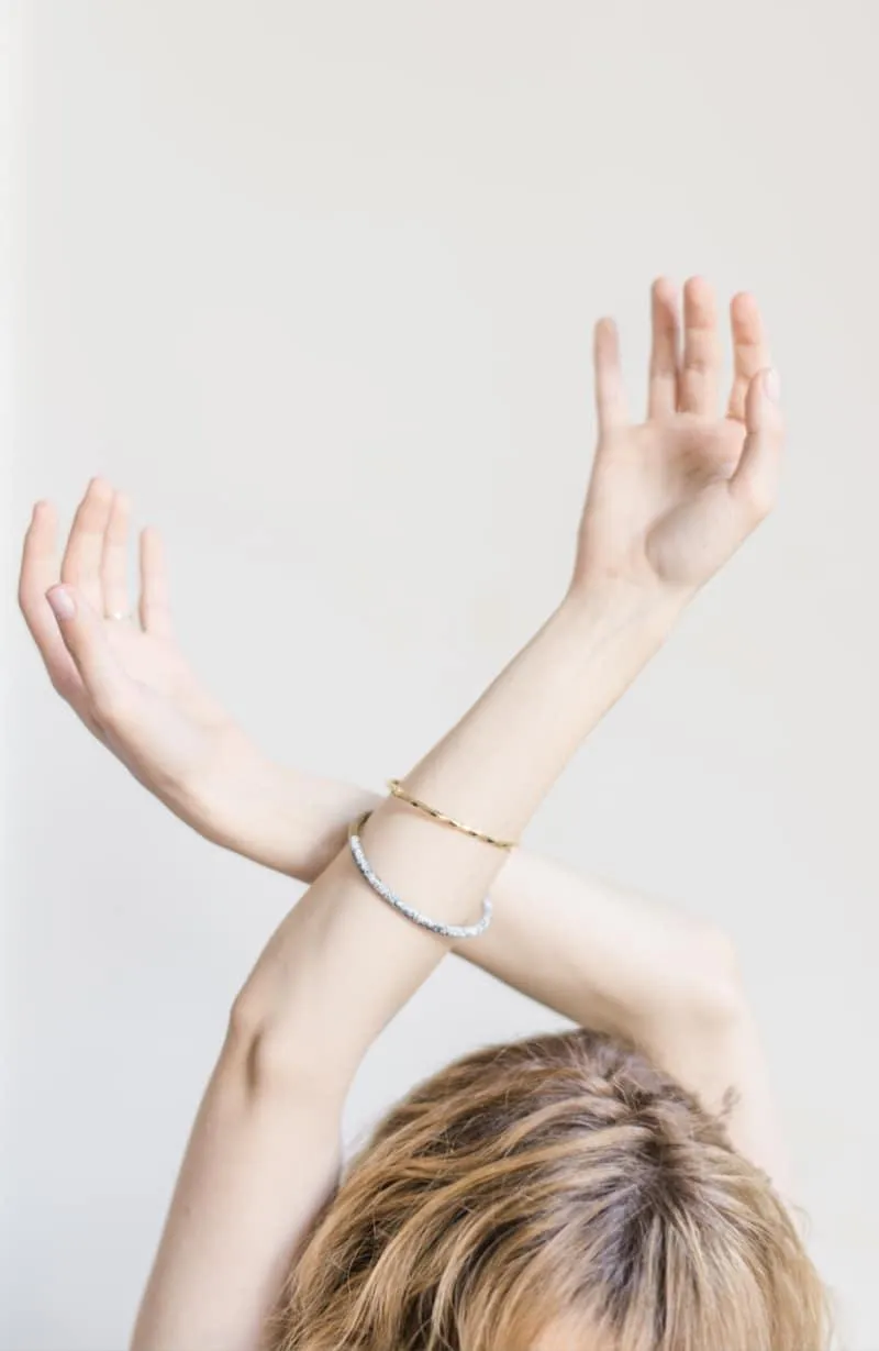 women holding hands in the air