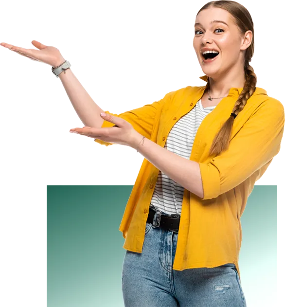 Smiling woman in a yellow shirt and jeans gesturing with both hands as if presenting or introducing something