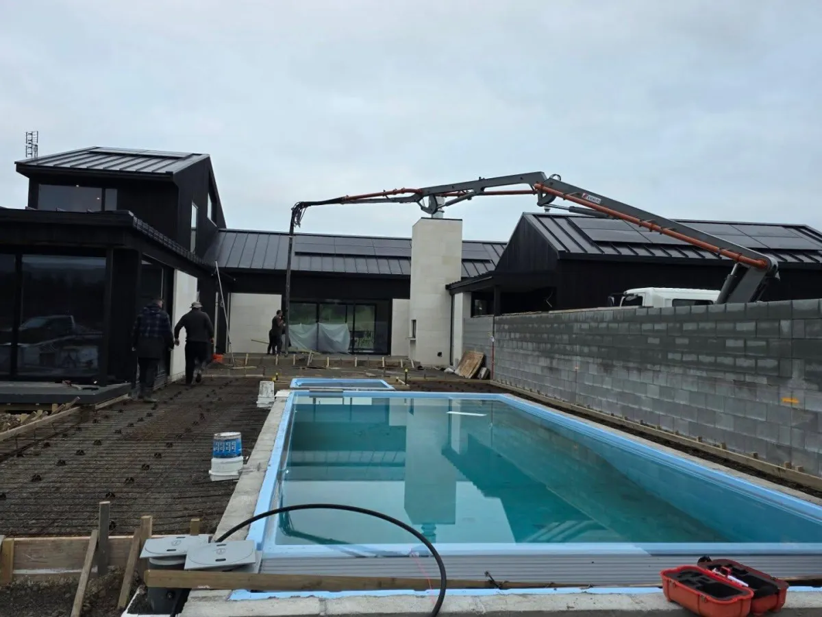 Concrete pumping job beside swimming pool Wairarapa