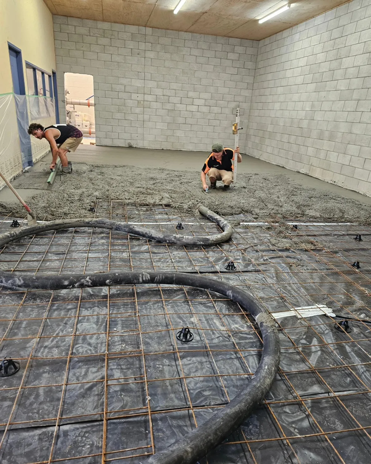 Precision concrete pumping for reinforced slab