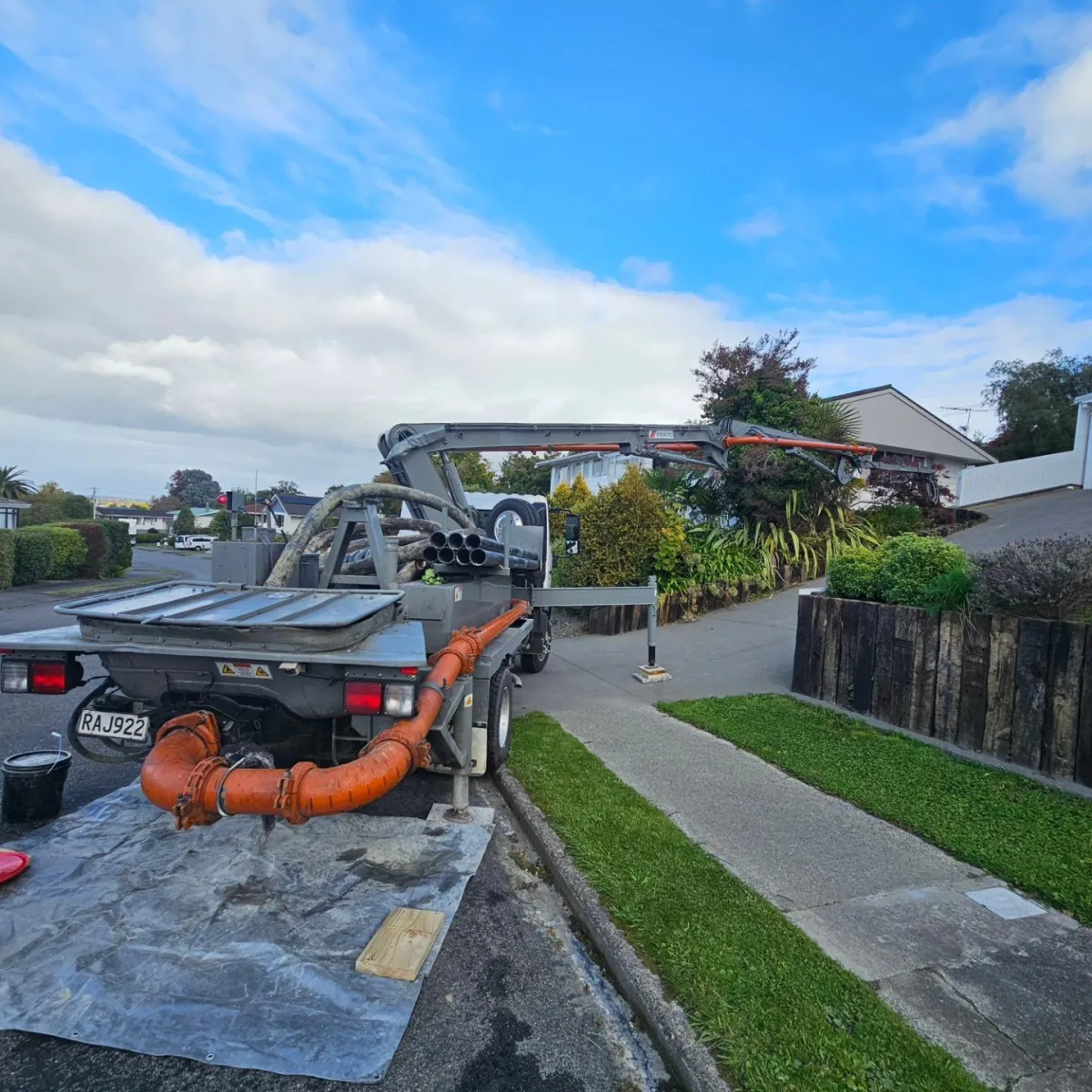 Concrete pumping truck working on suburban Wairarapa home