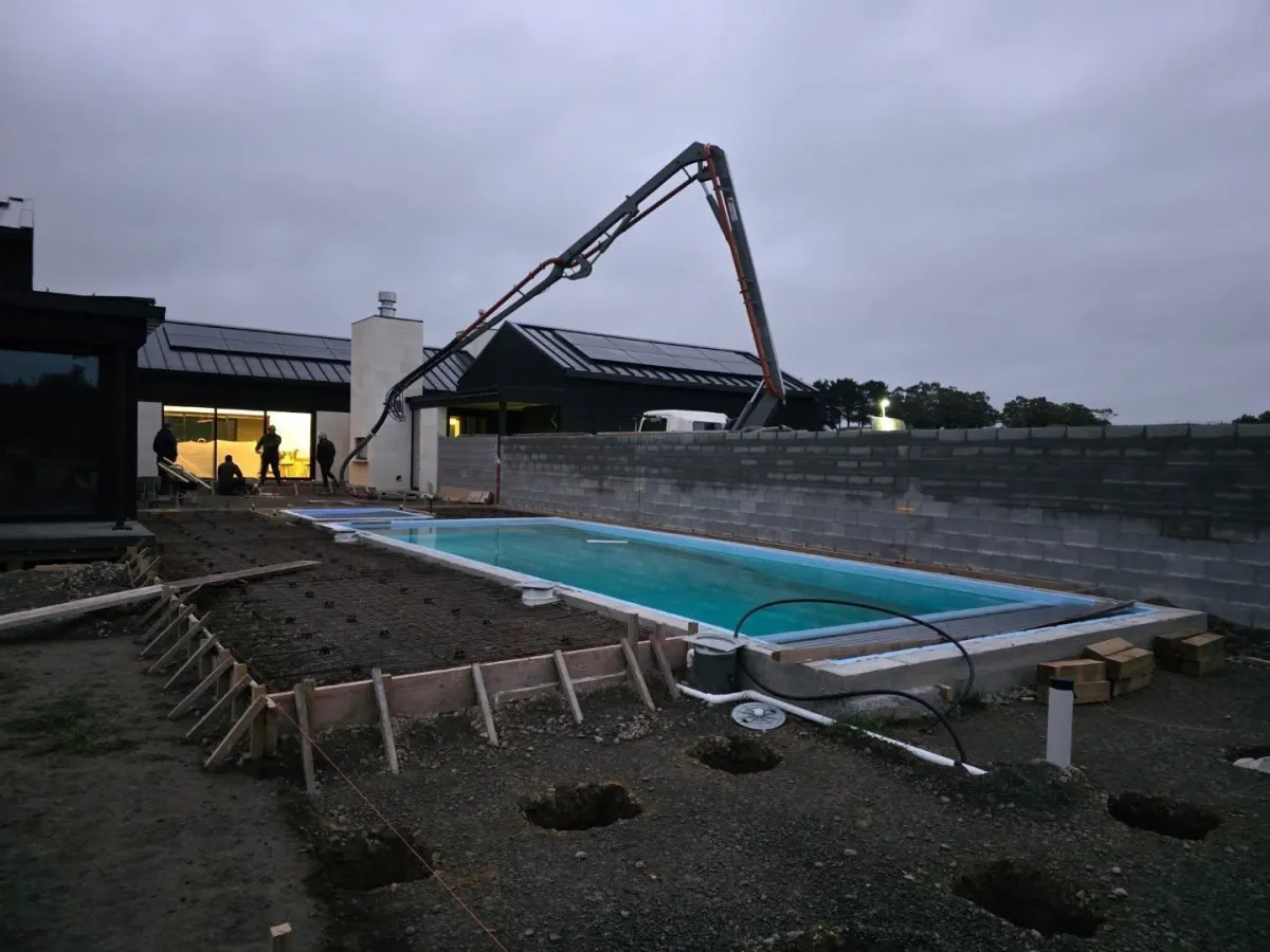 Concrete pumping job beside swimming pool Wairarapa