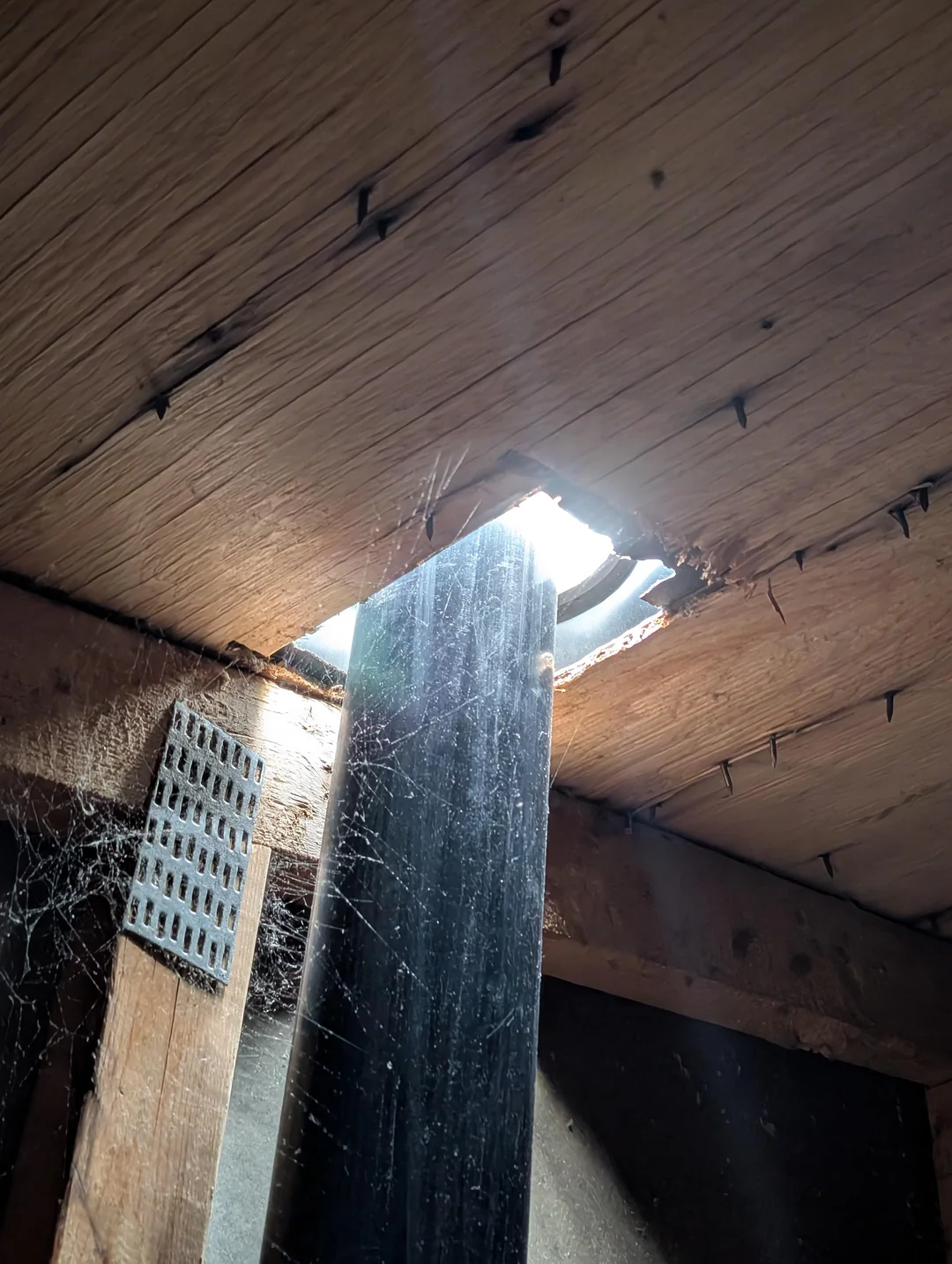 Hole in Roof Damage - Roofing Service Emergency Example