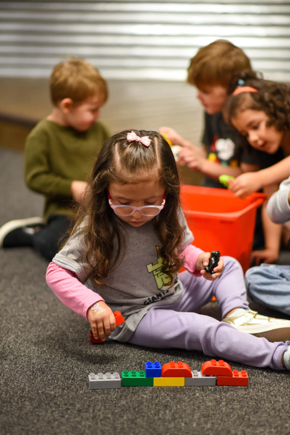 Girl watches a lesson about the alphabet on a laptop