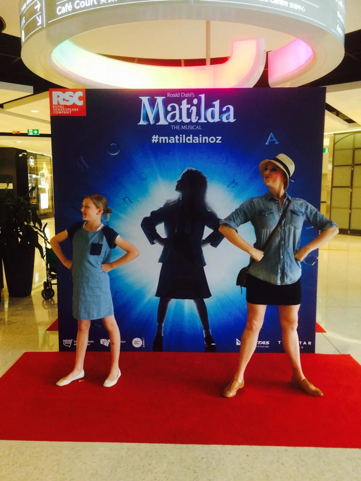 Man working on a laptop with desk lamps.