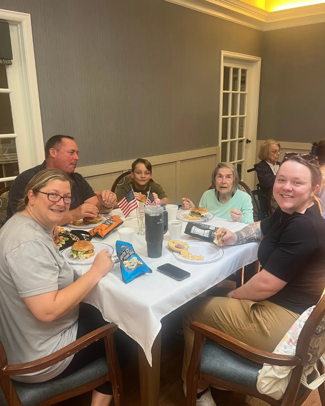 Resident eating lunch with heir family at Gulf Coast Memory Care