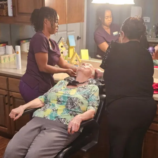 Gulf Coast Memory Care Team with resident on spa day