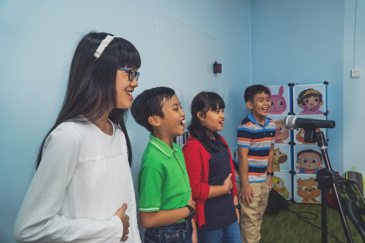 Children learning singing techniques