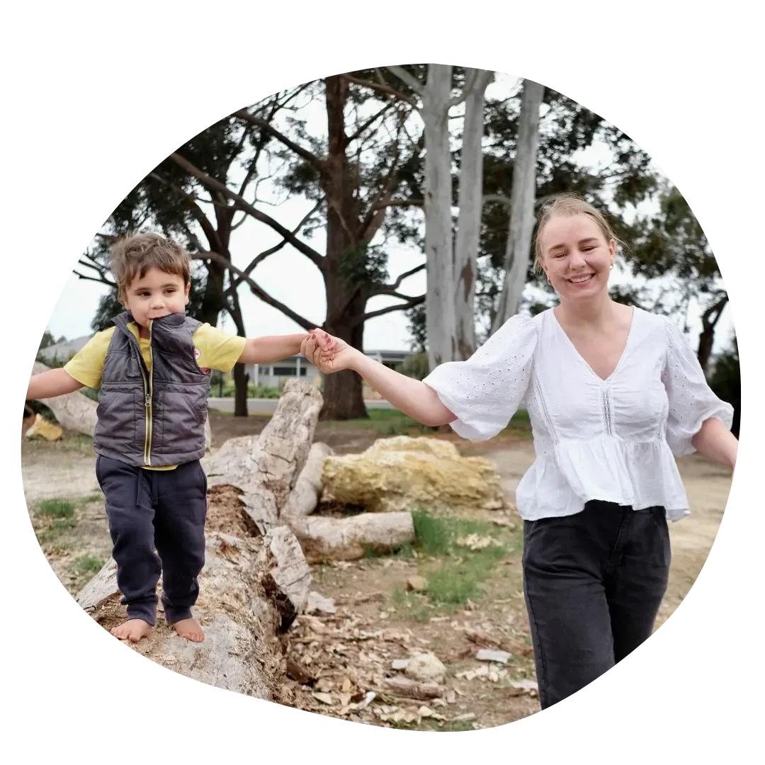 Paediatric Physiotherapist Assisting Kid Ride a Bike