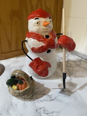 Snowman with garden hoe & veggie basket