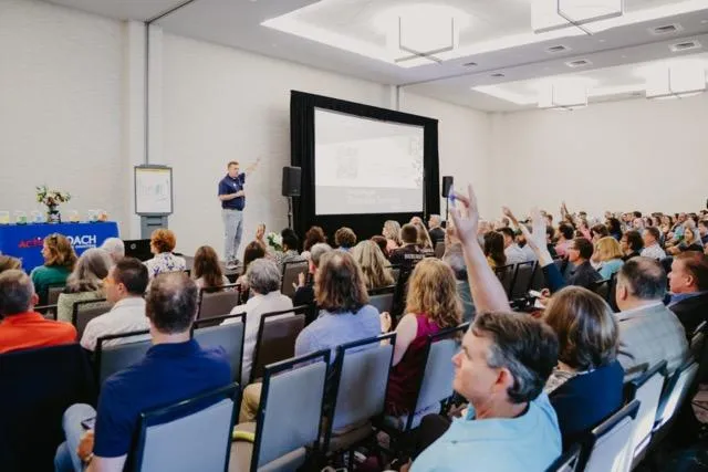 Sponsor presenting in front of business audience