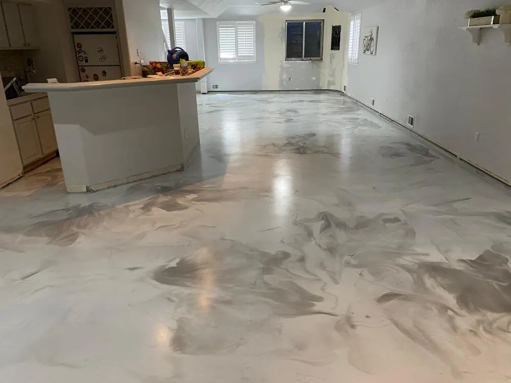 Metallic epoxy floor coating inside residential home with marbled finish