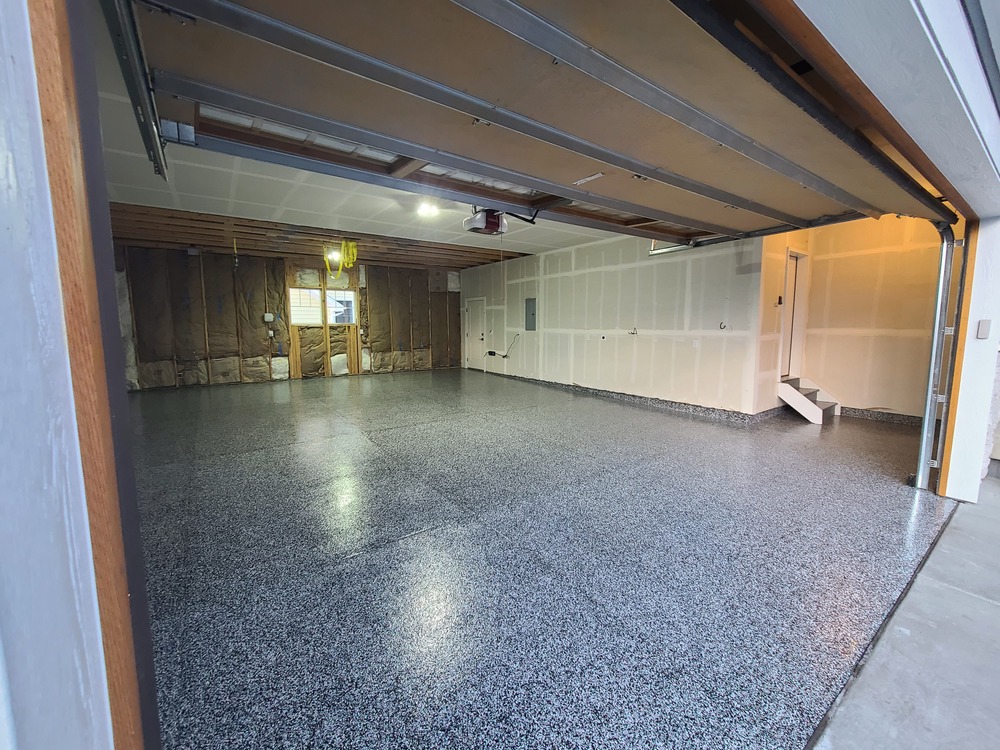 Finished garage with blue-gray epoxy flake floor coating system