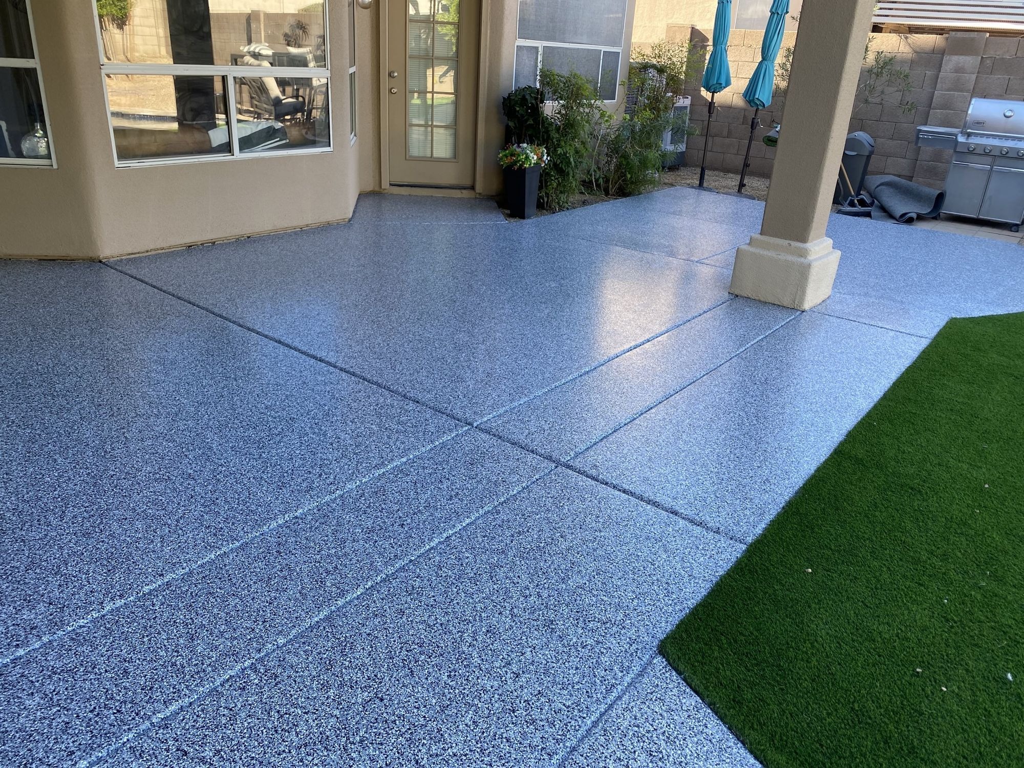 Residential patio with slip-resistant decorative concrete coating