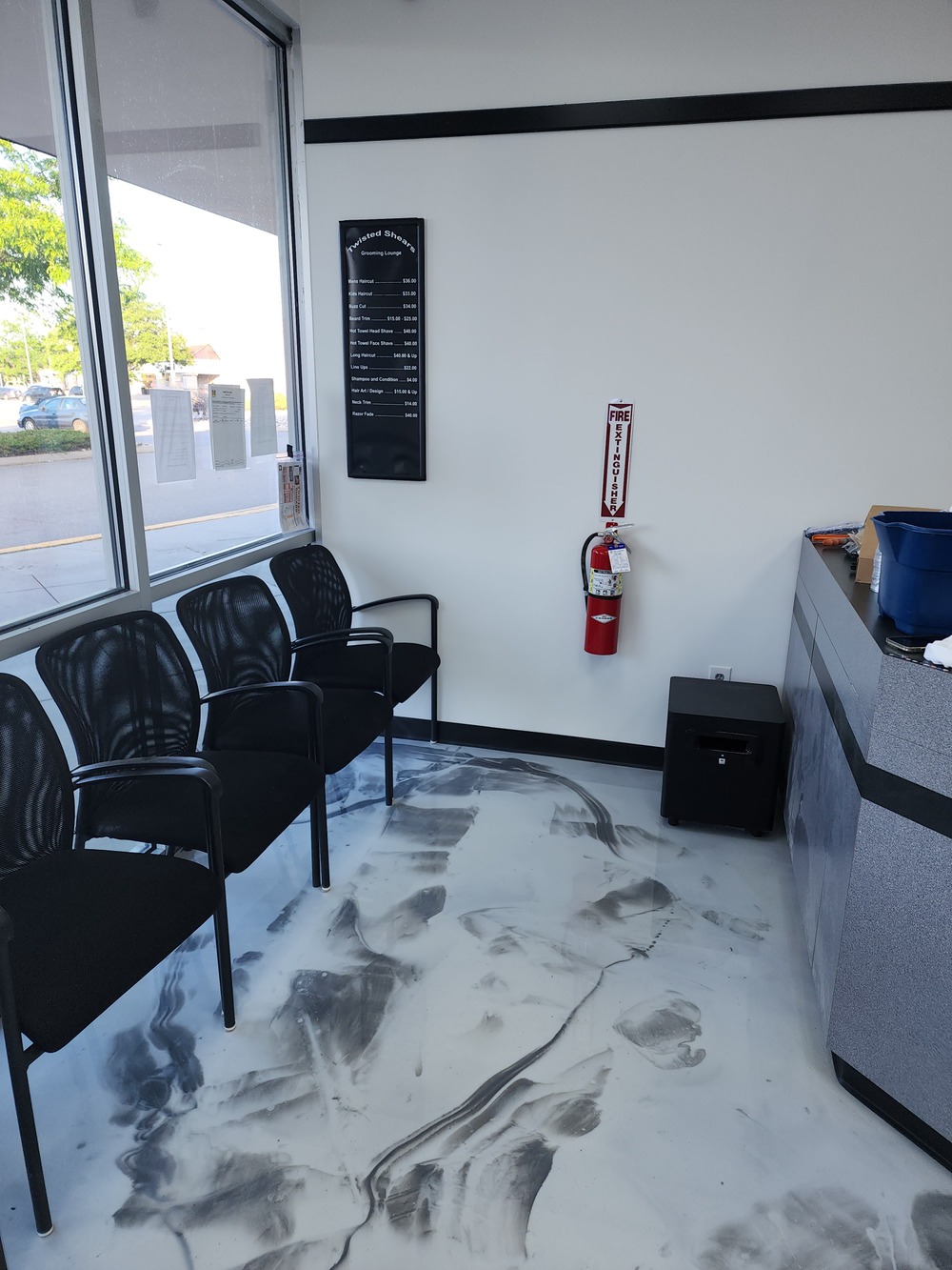Commercial office with metallic epoxy floor coating and seating area