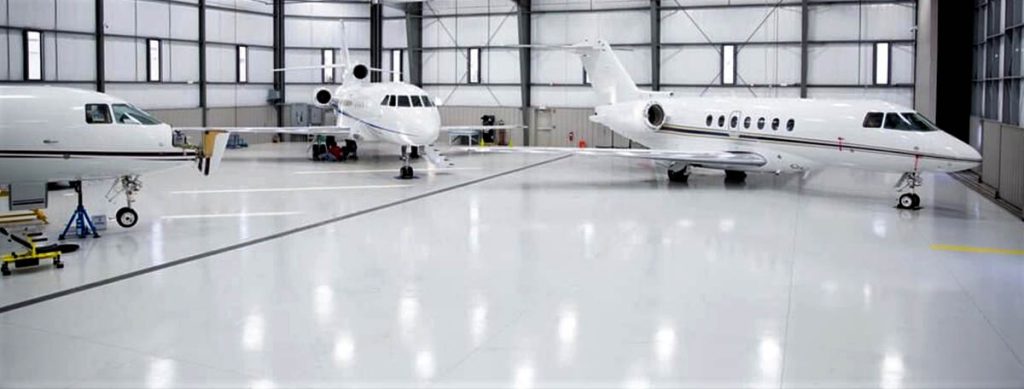 Aircraft hangar with high-gloss white epoxy floor coating