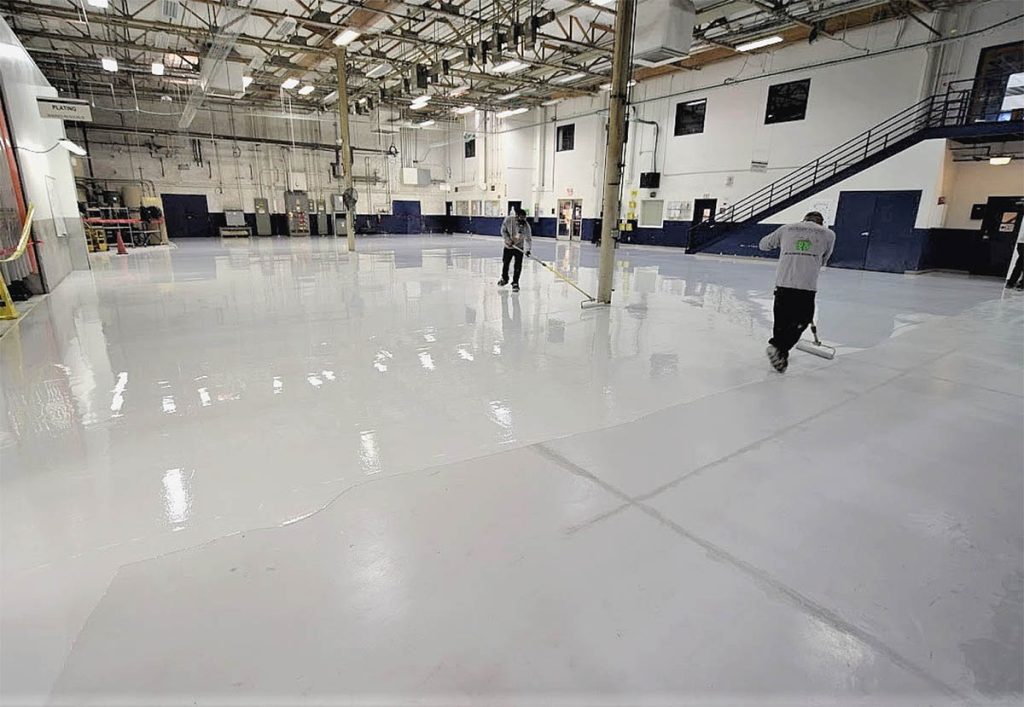 Large industrial warehouse with smooth white epoxy floor coating