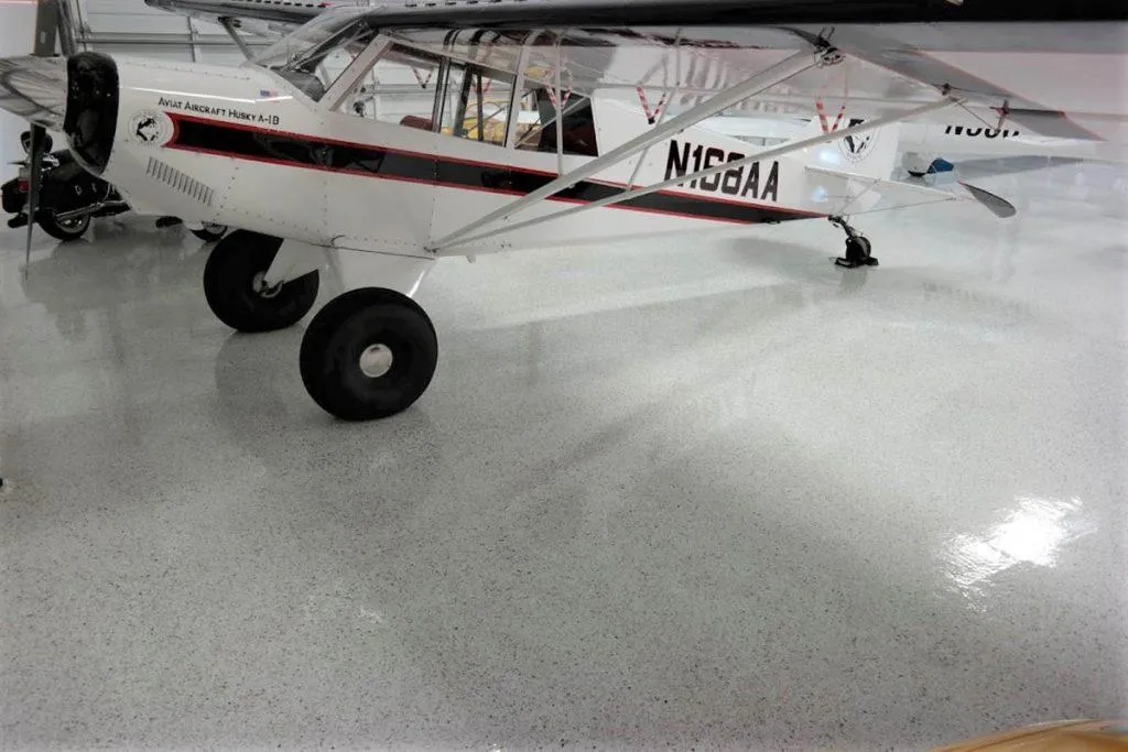 Airplane hangar floor with durable epoxy coating system