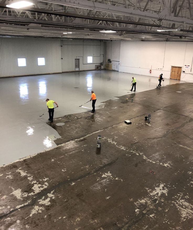 Commercial warehouse floor during epoxy coating installation process