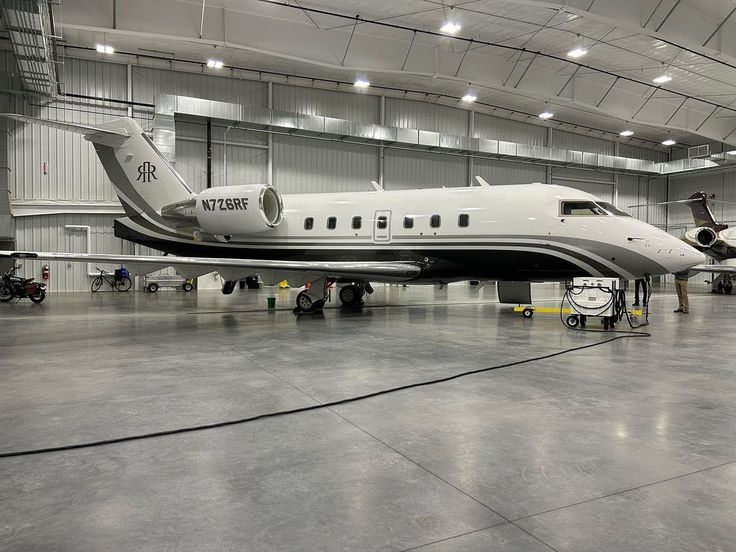 Aircraft hangar with polished concrete flooring before epoxy coating
